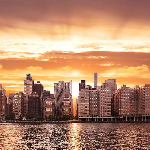 Thumbnail from A very high resolution cityscape VAST photo of the midtown Manhattan city skyline and East River during a beautiful sunset in New York City; created by Dan Piech