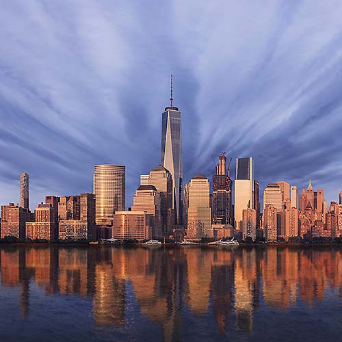 Thumbnail from A very high resolution cityscape VAST photo of the Financial District, Battery Park City, and the World Trade Center reflecting in the Hudson River at sunset in New York City; created by Dan Piech