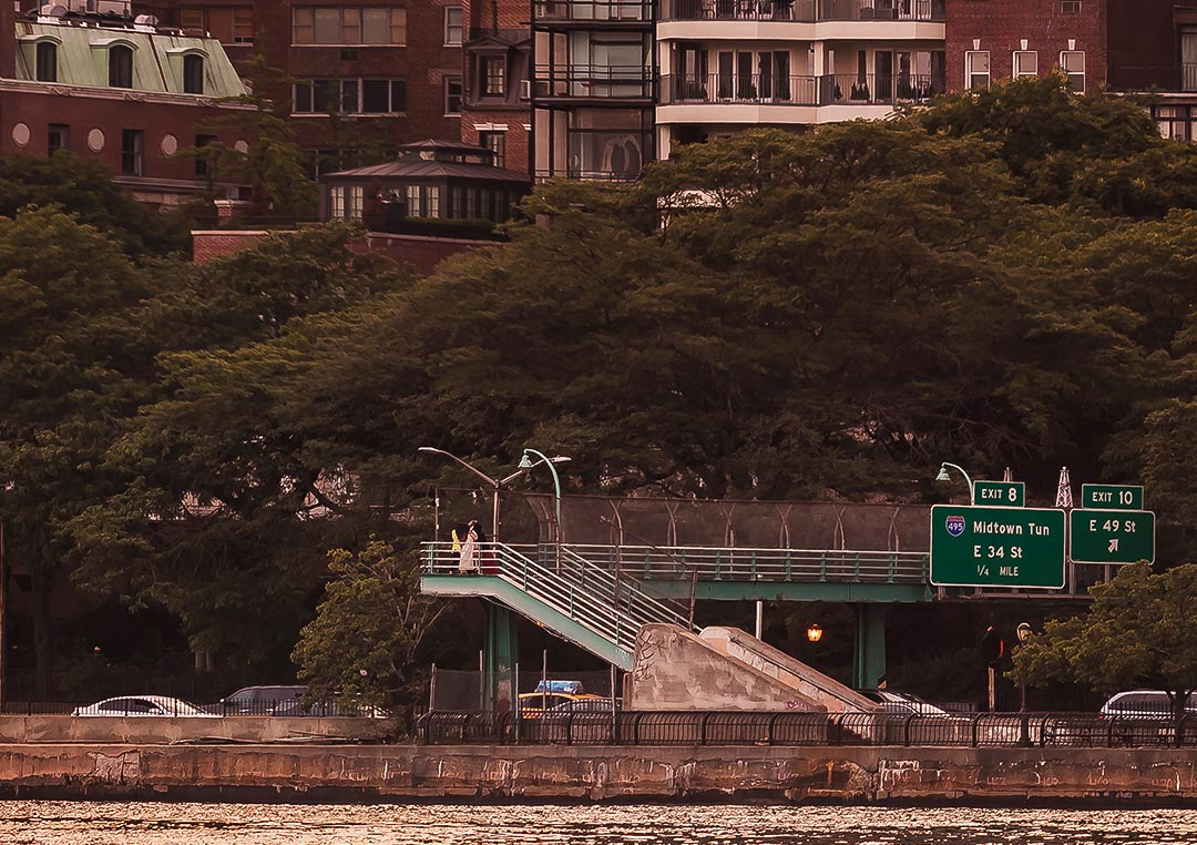 Close up of A very high resolution cityscape VAST photo of the midtown Manhattan city skyline and East River during a beautiful sunset in New York City; created by Dan Piech